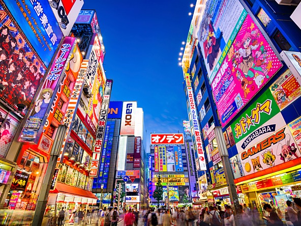 Street and digital billboards in Tokyo, Japan, at night